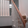 picture of oak bannister rail on stairs leading to a converted loft in south west london