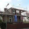 scaffolding on the outside of london house during loft conversion work